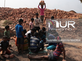 Brick field workers are eating lunch after his work shift in brickfields Narayanganj near Dhaka Bangladesh on January 12, 2019. (