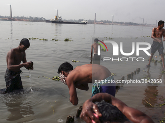 Brick field worker are having bath after his work shift in brickfields Narayanganj near Dhaka Bangladesh on January 12, 2019. (