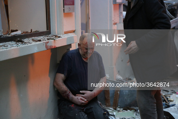 An injured man is seen after the explosion of a bakery on the corner of the streets Saint-Cecile and Rue de Trevise in central Paris on Janu...