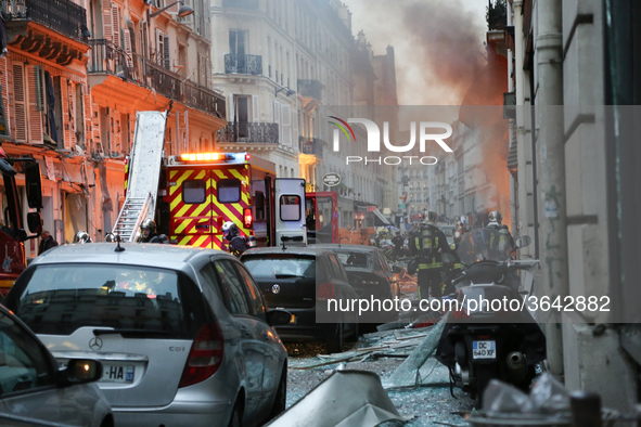 Firefighters respond the scene after A huge blast destroyed buildings and left casualties in French capital Paris on January 12, 2019. 