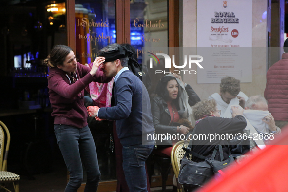 An injured man is treated by emergency workers after the explosion of a bakery on the corner of the streets Saint-Cecile and Rue de Trevise...