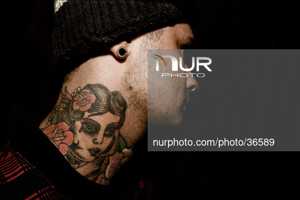 Portraits of tattooed people, in Milan, Italy. 