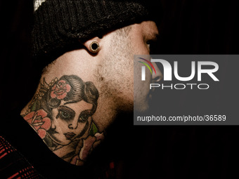 Portraits of tattooed people, in Milan, Italy. (