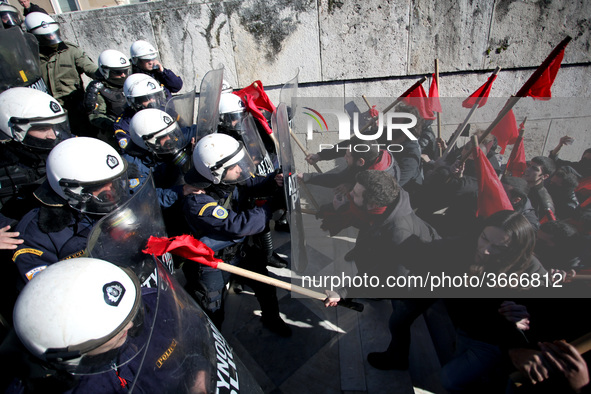 Greek school teachers and students clash with riot police during a protest outside the Greek Parliament in Athens, Greece on January 17, 201...