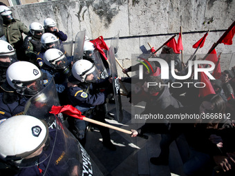 Greek school teachers and students clash with riot police during a protest outside the Greek Parliament in Athens, Greece on January 17, 201...