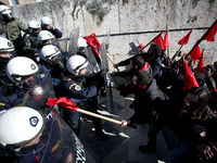 Greek school teachers and students clash with riot police during a protest outside the Greek Parliament in Athens, Greece on January 17, 201...