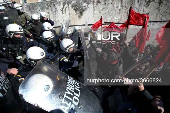 Greek school teachers and students clash with riot police during a protest outside the Greek Parliament in Athens, Greece on January 17, 201...