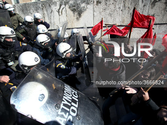 Greek school teachers and students clash with riot police during a protest outside the Greek Parliament in Athens, Greece on January 17, 201...