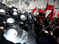 Greek school teachers and students clash with riot police during a protest outside the Greek Parliament in Athens, Greece on January 17, 201...