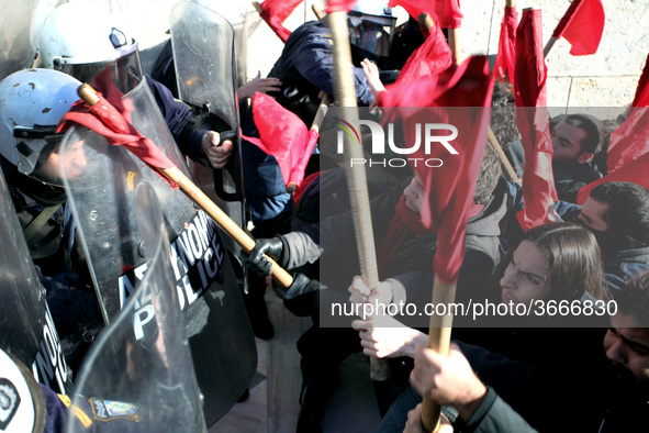 Greek school teachers and students clash with riot police during a protest outside the Greek Parliament in Athens, Greece on January 17, 201...