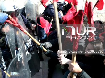 Greek school teachers and students clash with riot police during a protest outside the Greek Parliament in Athens, Greece on January 17, 201...