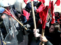 Greek school teachers and students clash with riot police during a protest outside the Greek Parliament in Athens, Greece on January 17, 201...