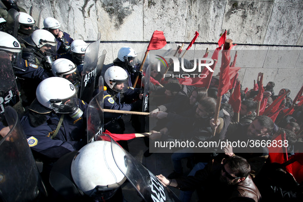 Greek school teachers and students clash with riot police during a protest outside the Greek Parliament in Athens, Greece on January 17, 201...