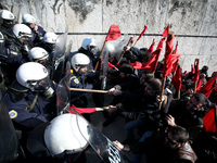 Greek school teachers and students clash with riot police during a protest outside the Greek Parliament in Athens, Greece on January 17, 201...