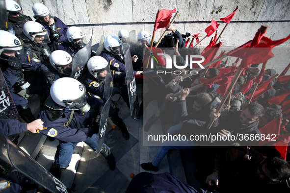 Greek school teachers and students clash with riot police during a protest outside the Greek Parliament in Athens, Greece on January 17, 201...