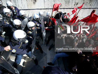 Greek school teachers and students clash with riot police during a protest outside the Greek Parliament in Athens, Greece on January 17, 201...