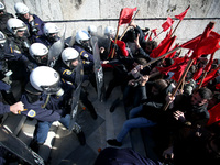 Greek school teachers and students clash with riot police during a protest outside the Greek Parliament in Athens, Greece on January 17, 201...