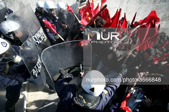 Greek school teachers and students clash with riot police during a protest outside the Greek Parliament in Athens, Greece on January 17, 201...