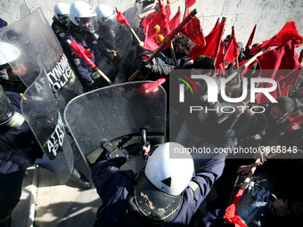 Greek school teachers and students clash with riot police during a protest outside the Greek Parliament in Athens, Greece on January 17, 201...