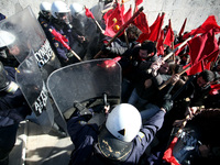 Greek school teachers and students clash with riot police during a protest outside the Greek Parliament in Athens, Greece on January 17, 201...