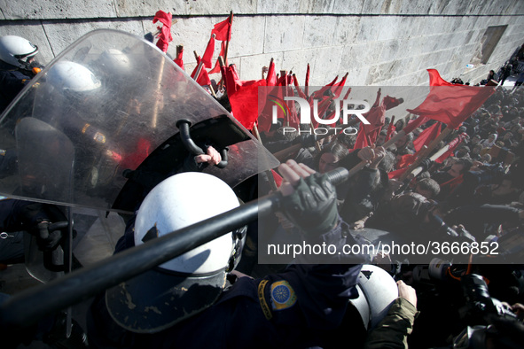 Greek school teachers and students clash with riot police during a protest outside the Greek Parliament in Athens, Greece on January 17, 201...