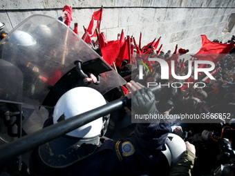 Greek school teachers and students clash with riot police during a protest outside the Greek Parliament in Athens, Greece on January 17, 201...