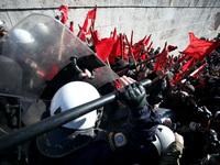 Greek school teachers and students clash with riot police during a protest outside the Greek Parliament in Athens, Greece on January 17, 201...