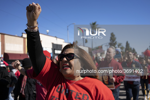 Striking teachers with the Los Angeles Unified School District and supporters of public education march in a parade honoring Dr. Martin Luth...