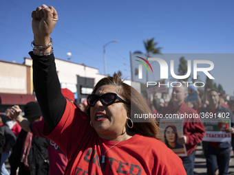 Striking teachers with the Los Angeles Unified School District and supporters of public education march in a parade honoring Dr. Martin Luth...