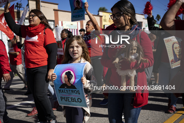 Striking teachers with the Los Angeles Unified School District and supporters of public education march in a parade honoring Dr. Martin Luth...