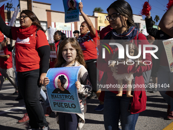 Striking teachers with the Los Angeles Unified School District and supporters of public education march in a parade honoring Dr. Martin Luth...