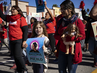 Striking teachers with the Los Angeles Unified School District and supporters of public education march in a parade honoring Dr. Martin Luth...