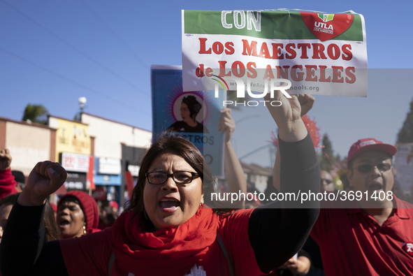 Striking teachers with the Los Angeles Unified School District and supporters of public education march in a parade honoring Dr. Martin Luth...