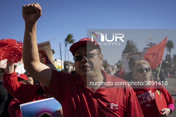 Striking teachers with the Los Angeles Unified School District and supporters of public education march in a parade honoring Dr. Martin Luth...