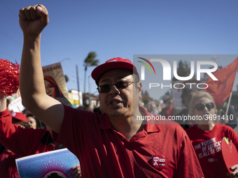 Striking teachers with the Los Angeles Unified School District and supporters of public education march in a parade honoring Dr. Martin Luth...