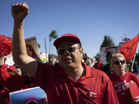 Striking teachers with the Los Angeles Unified School District and supporters of public education march in a parade honoring Dr. Martin Luth...