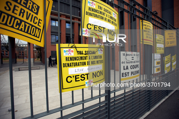 Demonstrators put placards on the metal gates of the Local board of Education of Toulouse. Several schoolteachers unions and two students un...