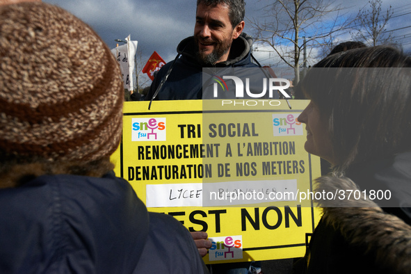 A man holds a placard reading 'Social selecting, ambition renunciation, Blanquer highschool, it's NO !'.  Several schoolteachers unions and...