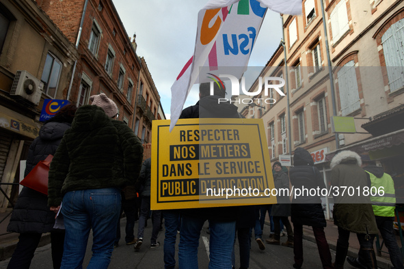 A teacher has a placard on his back reading 'Respect our jobs in the Public Service of Education'. Several schoolteachers unions and two stu...