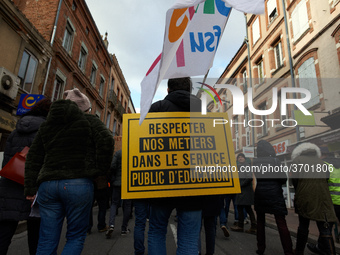 A teacher has a placard on his back reading 'Respect our jobs in the Public Service of Education'. Several schoolteachers unions and two stu...