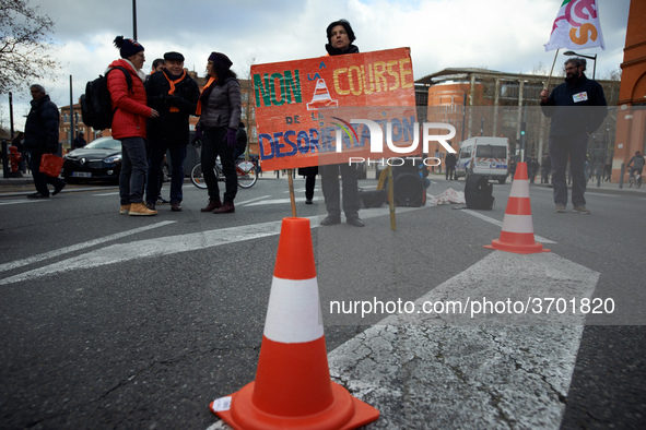 A teacher holds a placard reading 'No to the desorientation run'. Several schoolteachers unions and two students unions (UNL, FIDL) called f...