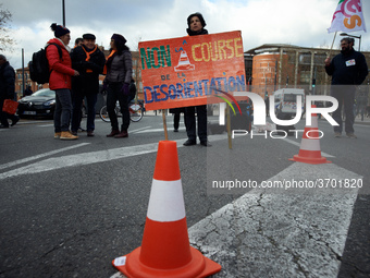 A teacher holds a placard reading 'No to the desorientation run'. Several schoolteachers unions and two students unions (UNL, FIDL) called f...