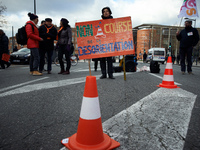 A teacher holds a placard reading 'No to the desorientation run'. Several schoolteachers unions and two students unions (UNL, FIDL) called f...