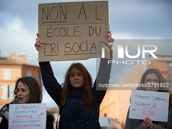 A student holds a placard reading 'No to a school of social selecting'. Several schoolteachers unions and two students unions (UNL, FIDL) ca...