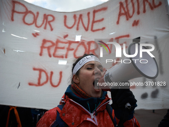 A student shouts slogans in front of a banner reading 'For an other reform for the highschool'. Several schoolteachers unions and two studen...