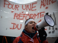 A student shouts slogans in front of a banner reading 'For an other reform for the highschool'. Several schoolteachers unions and two studen...