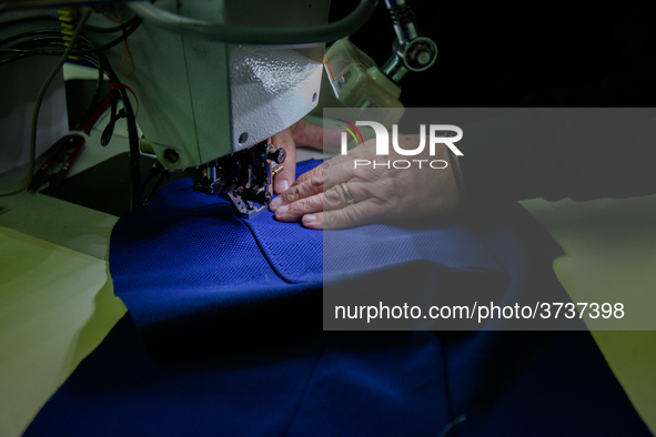 A person works inside a Neapolitan tailoring factory in Naples, Italy, on January 30, 2019 