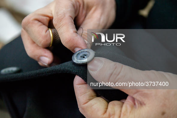 A person works inside a Neapolitan tailoring factory in Naples, Italy, on January 30, 2019 