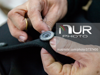 A person works inside a Neapolitan tailoring factory in Naples, Italy, on January 30, 2019 (