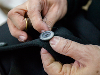 A person works inside a Neapolitan tailoring factory in Naples, Italy, on January 30, 2019 (